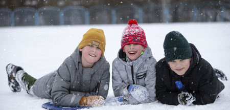children-winter-three-little-boy-friends-lie-snow-look-camera